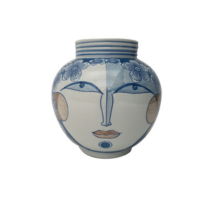Vase boule bleu à motif visage